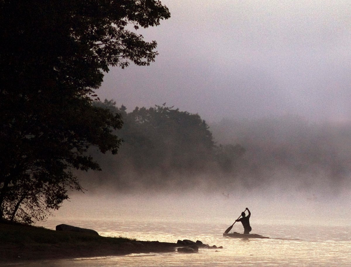 A sprint canoe paddler trains in early morning fog on Lake Banook in Dartmouth, N.S. on Wednesday, Sept. 19, 2007. 
