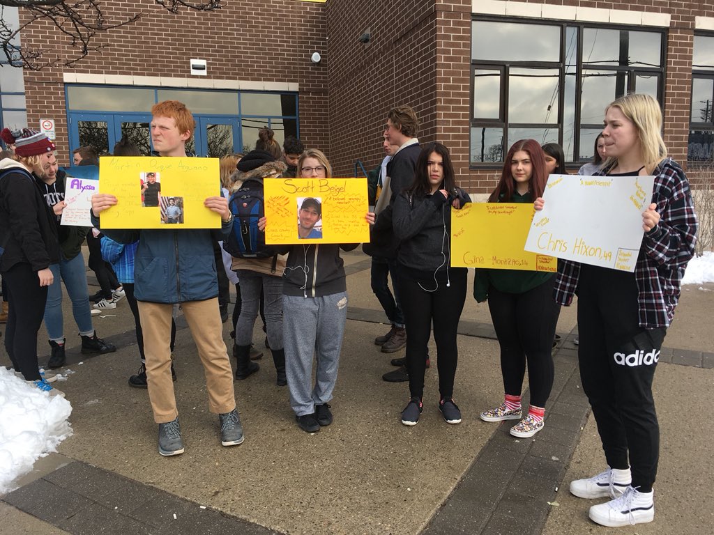 H.B. Beal students held signs with names and information about the victims of the Marjory Stoneman Douglas shooting during Wednesday's walkout.