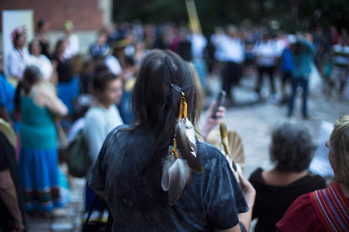 Sixties Scoop survivors and supporters gather for a demonstration at a courthouse on the day of a class-action court hearing in Toronto on Tuesday, August 23, 2016.