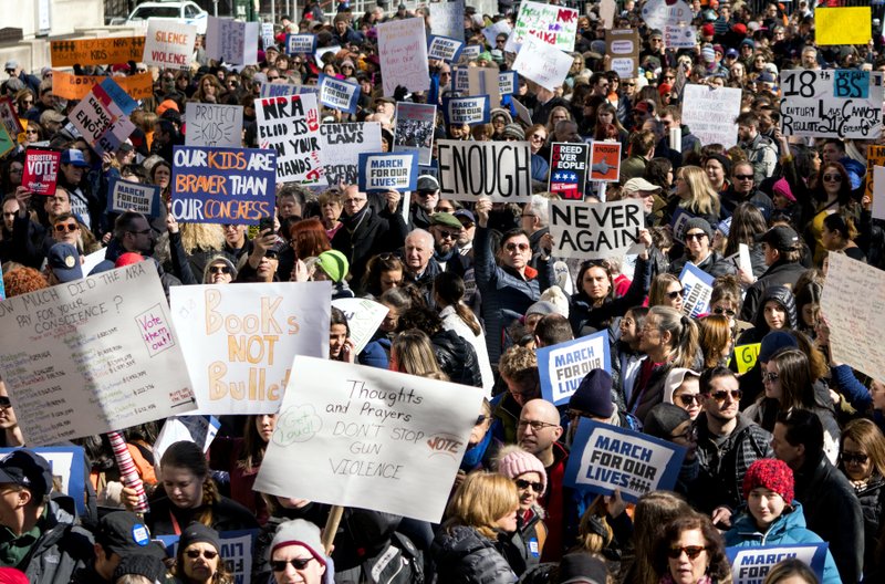 People take part in a march rally against gun violence Saturday, March 24, 2018, in New York. Tens of thousands of people poured into the nation’s capital and cities across America on Saturday to march for gun control and ignite political activism among the young. (AP Photo/Craig Ruttle)