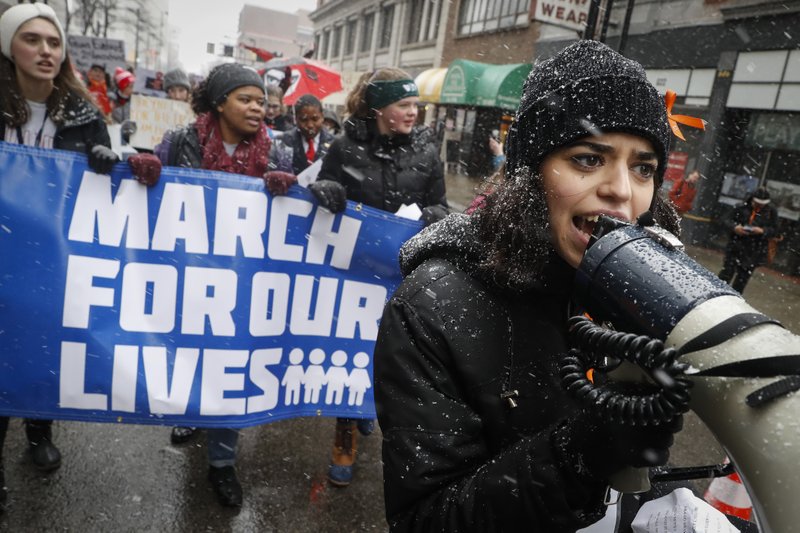 Organizer Rasleen Krupp, 17, Wyoming High School, leads a “March for Our Lives” protest for gun legislation and school safety, Saturday, March 24, 2018, in Cincinnati. (AP Photo/John Minchillo)