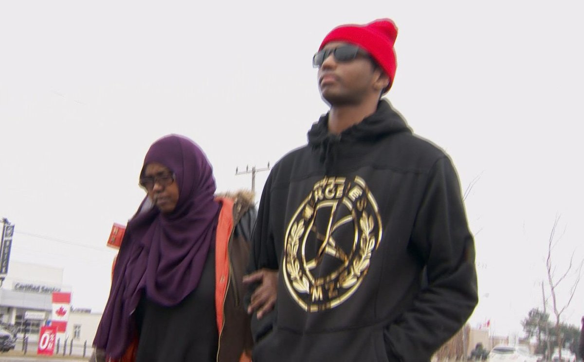 Abdoul Abdi (R) attended a deportation hearing on March 7, 2018.