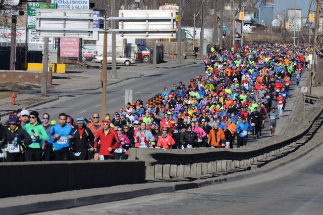 A large group of runners for the Race around the Bay in Hamilton, Ont., March 29, 2015. THE CANADIAN PRESS IMAGES/Stephen C. Host.