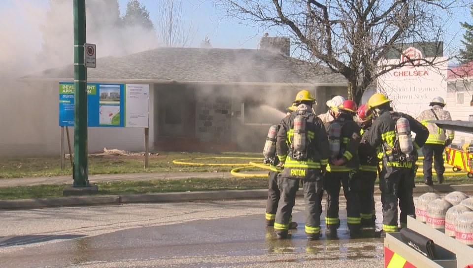 Firefighters knock down a fire that broke out at this home on Cambie St. Saturday afternoon.