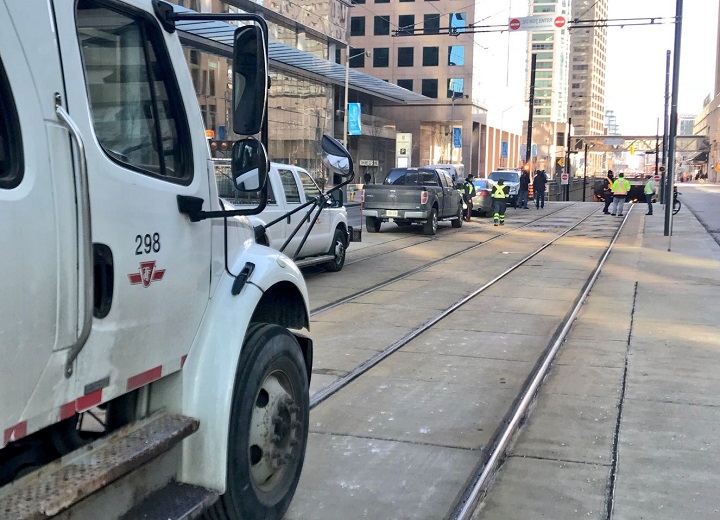 TTC crews and Toronto police were called to the Queens Quay streetcar tunnel Saturday morning after a car got stuck in the tunnel.