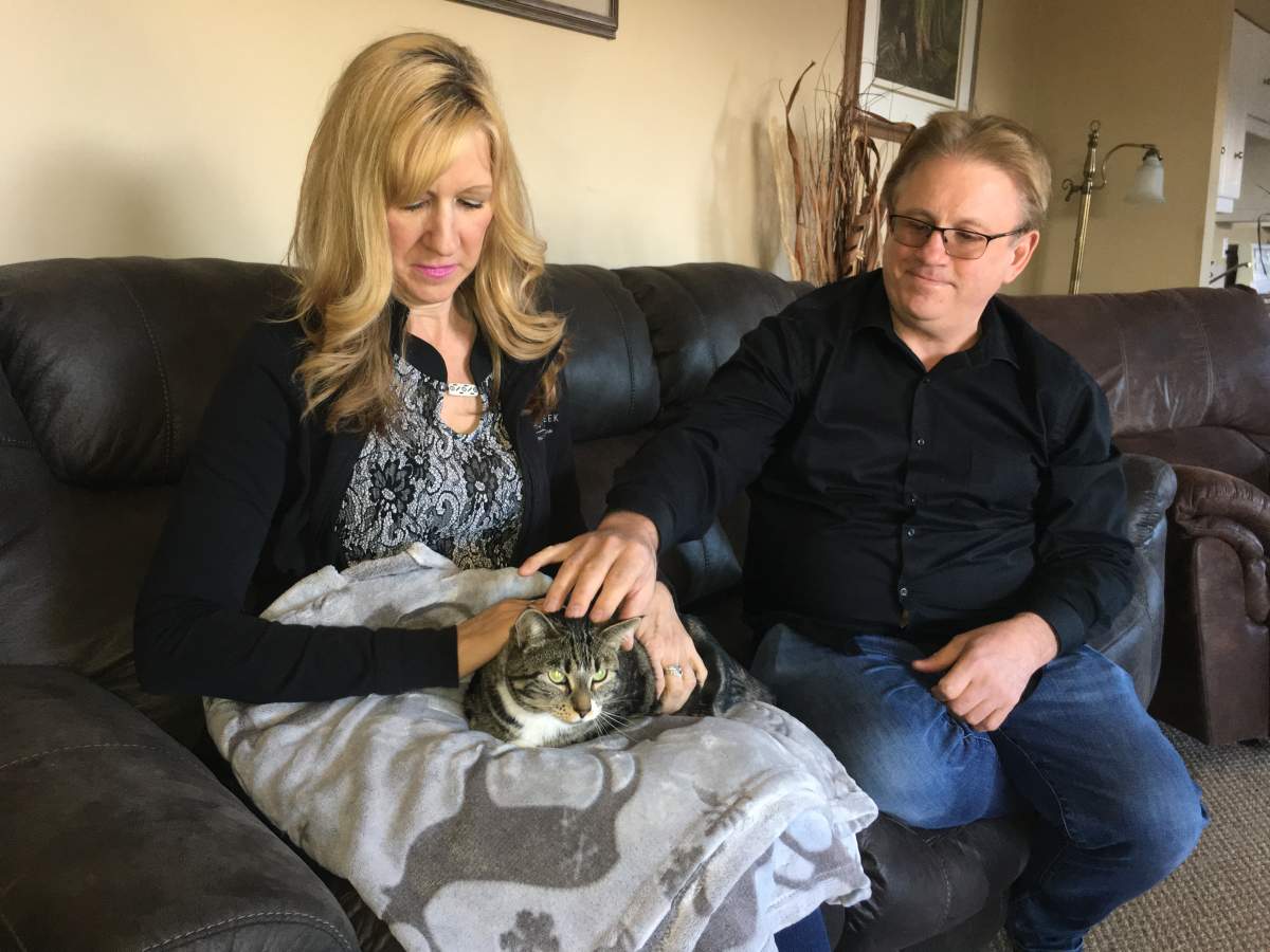 Jackie Champion, Garry Schroth and their cat Kiki.