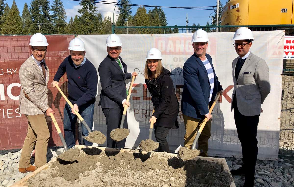 Coquitlam mayor Richard Stewart (third from left) joins city councillors and representatives from Redbrick Properties to mark the start of construction on a new market rental housing unit Saturday.