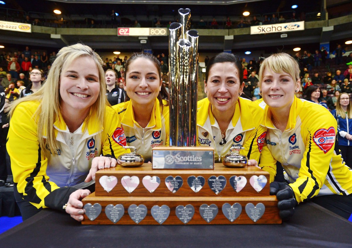 Manitoba, left to right, Jennifer Jones, Shannon Birchard, Jill Officer and Dawn McEwen pose with the trophy after their win at the Scotties Tournament of Hearts in Penticton, B.C., Feb. 4, 2018.