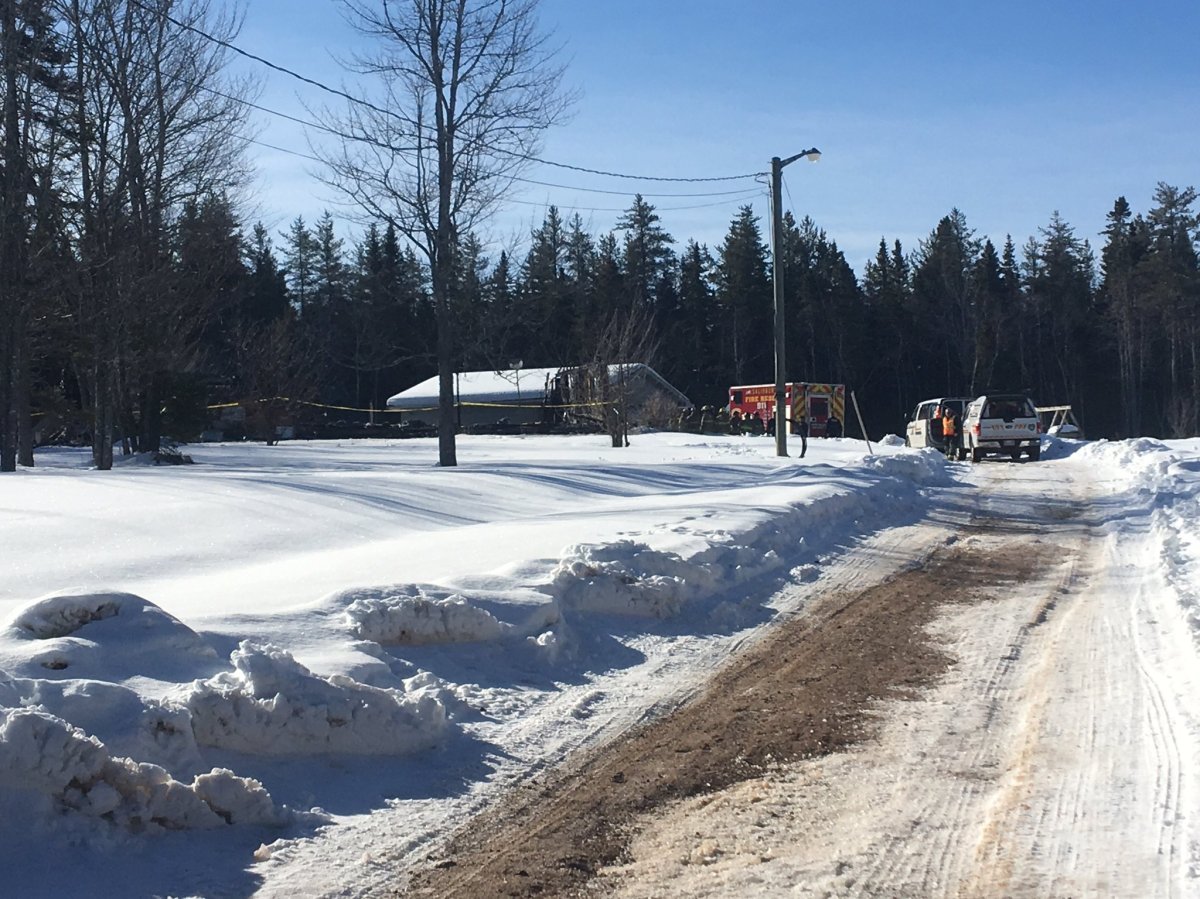 Emergency services attend to a fatal house fire in Colpitts Settlement, N.B., on March 21, 2018.