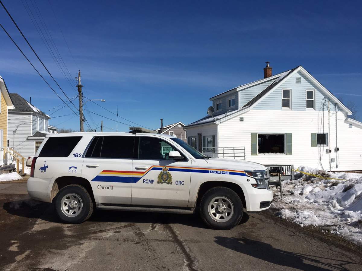 An RCMP cruiser sits in front of the scene of a fatal fire in Springhill, N.S., on March 21, 2018.