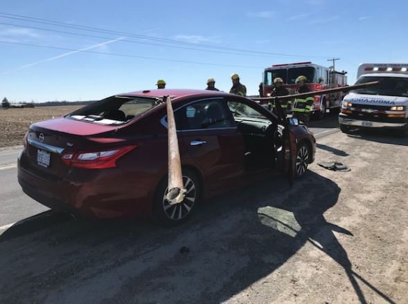 Driver escapes serious injury after pole from truck smashes vehicle ...