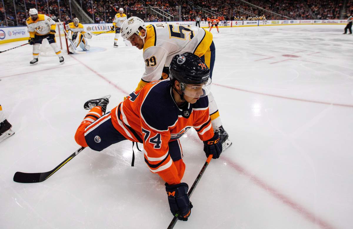 Nashville Predators’ Roman Josi (59) trips up Edmonton Oilers’ Ethan Bear (74) during second period NHL action in Edmonton, Alta., on Thursday March 1, 2018.