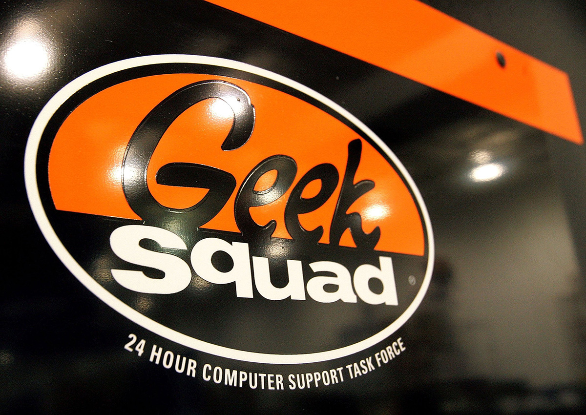  A "Geek Squad" sign hangs on a door to its computer repair facility in a Best Buy store June 6, 2006 in Niles, Illinois.
