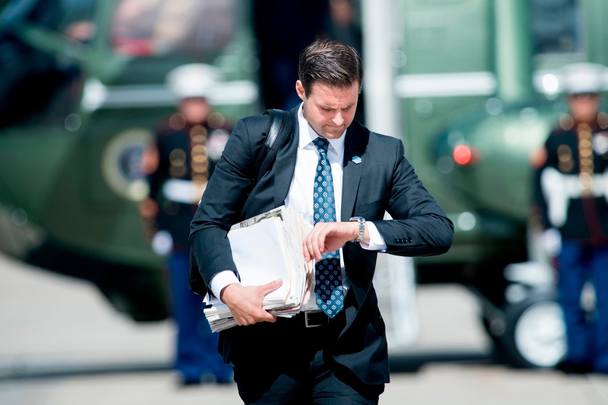 FILE - John McEntee, special assistant and personal aide follows US President Donald Trump to Air Force One at Andrews Air Force Base September 27, 2017 in Maryland.