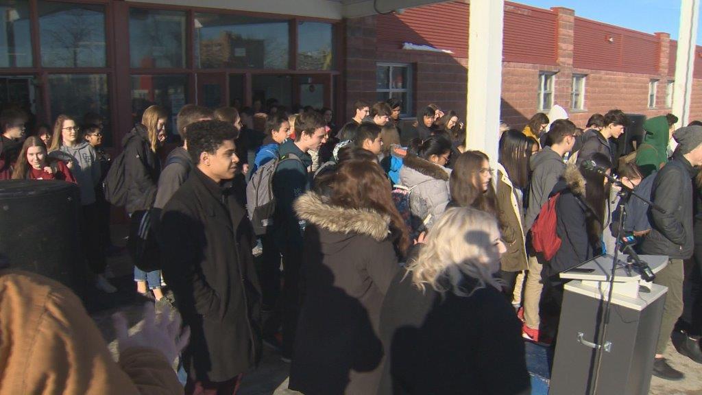 Students walk out of Grant Park High School Wednesday morning.