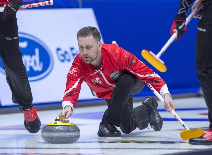 Team Canada skip Brad Gushue delivers a rock as they play Nova Scotia at the Tim Hortons Brier curling championship at the Brandt Centre in Regina on Tuesday, March 6, 2018. 