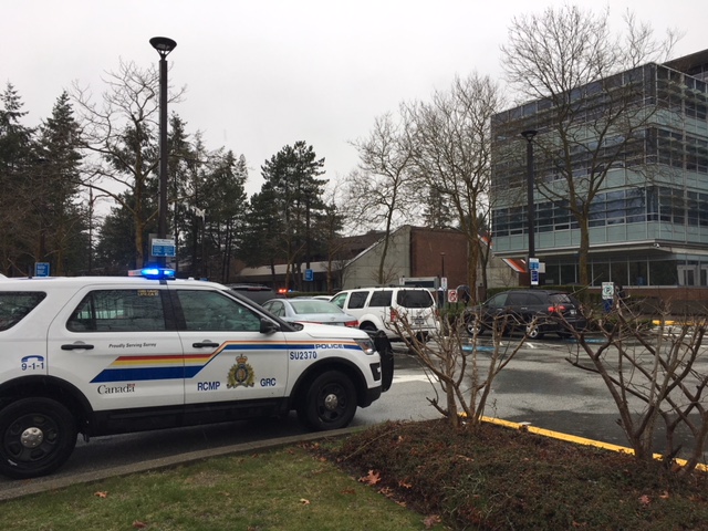 An RCMP SUV outside the Canada Revenue Agency office in Surrey.