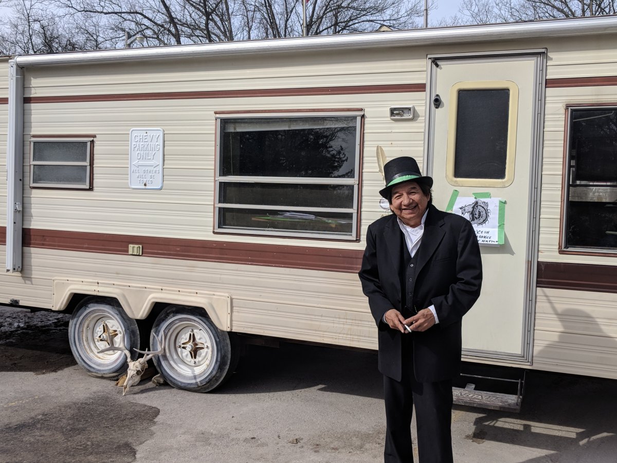 Maynard T. George stands in front of the trailer blocking the entrance to Pinery Provincial Park on March 21, 2018.