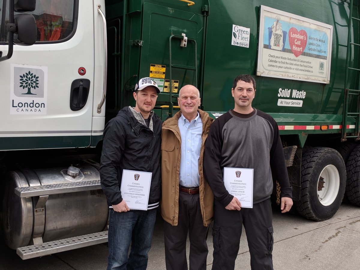 City workers Jon Sweitzer (left) and Chris Lynch (right) are being credited with helping save Doug Cairns' (middle) life.