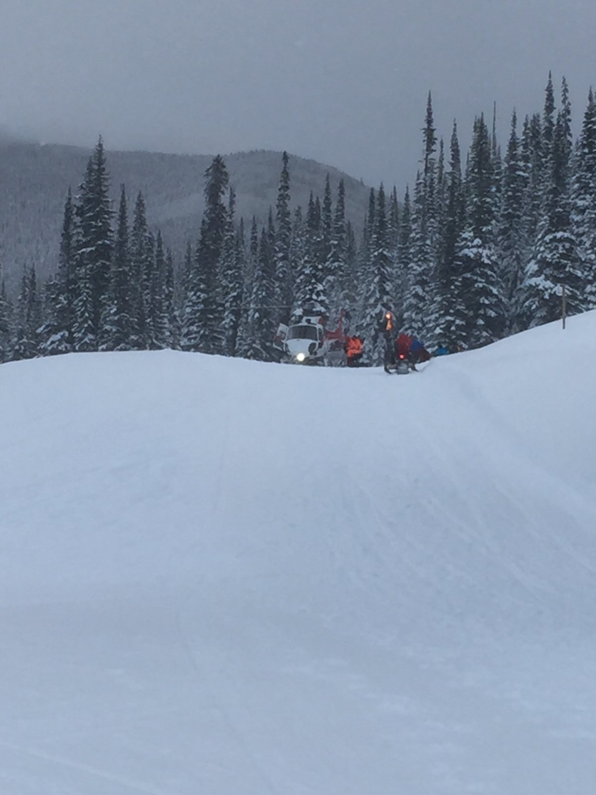 A helicopter was called to take a man to hospital after he was buried by an avalanche near Apex Ski Resort. 