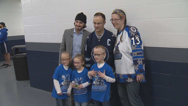 Ivan and his family at their meet and greet with Manitoba Moose forward Nic Petan.
