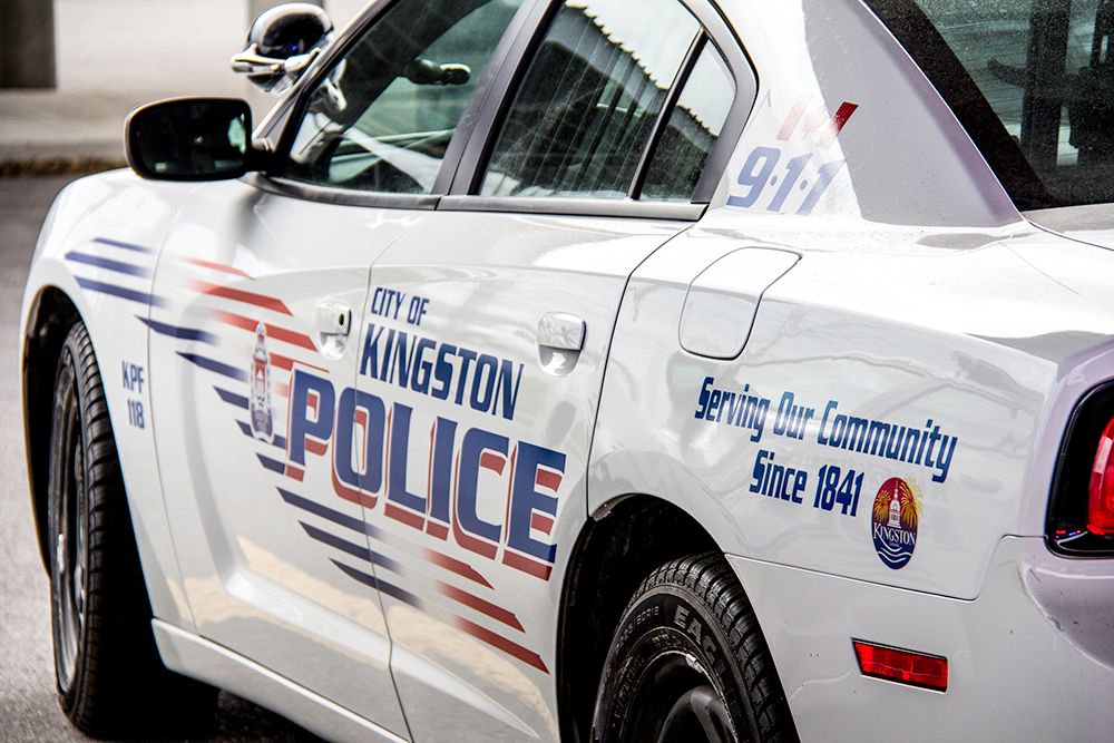 Kingston police say a man punched two random people in the head in the same day.