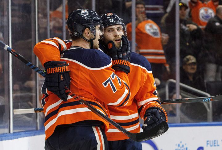 Edmonton Oilers' Oscar Klefbom (77) and Leon Draisaitl (29) celebrate a goal against the Arizona Coyotes during overtime NHL action in Edmonton, Alta., on Monday March 5, 2018. 