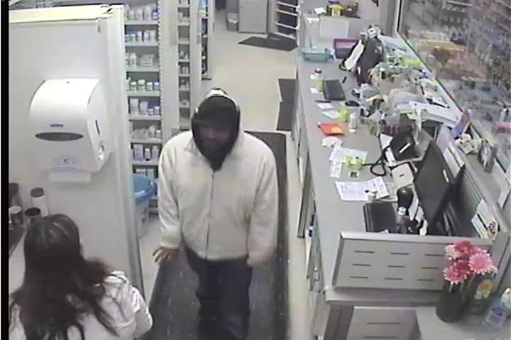 Image from surveillance video captured at Leduc Co-Op Pharmacy on Feb. 10, 2018 shows a man police suspect is behind the theft of drugs at different pharmacies in Leduc, Alta.