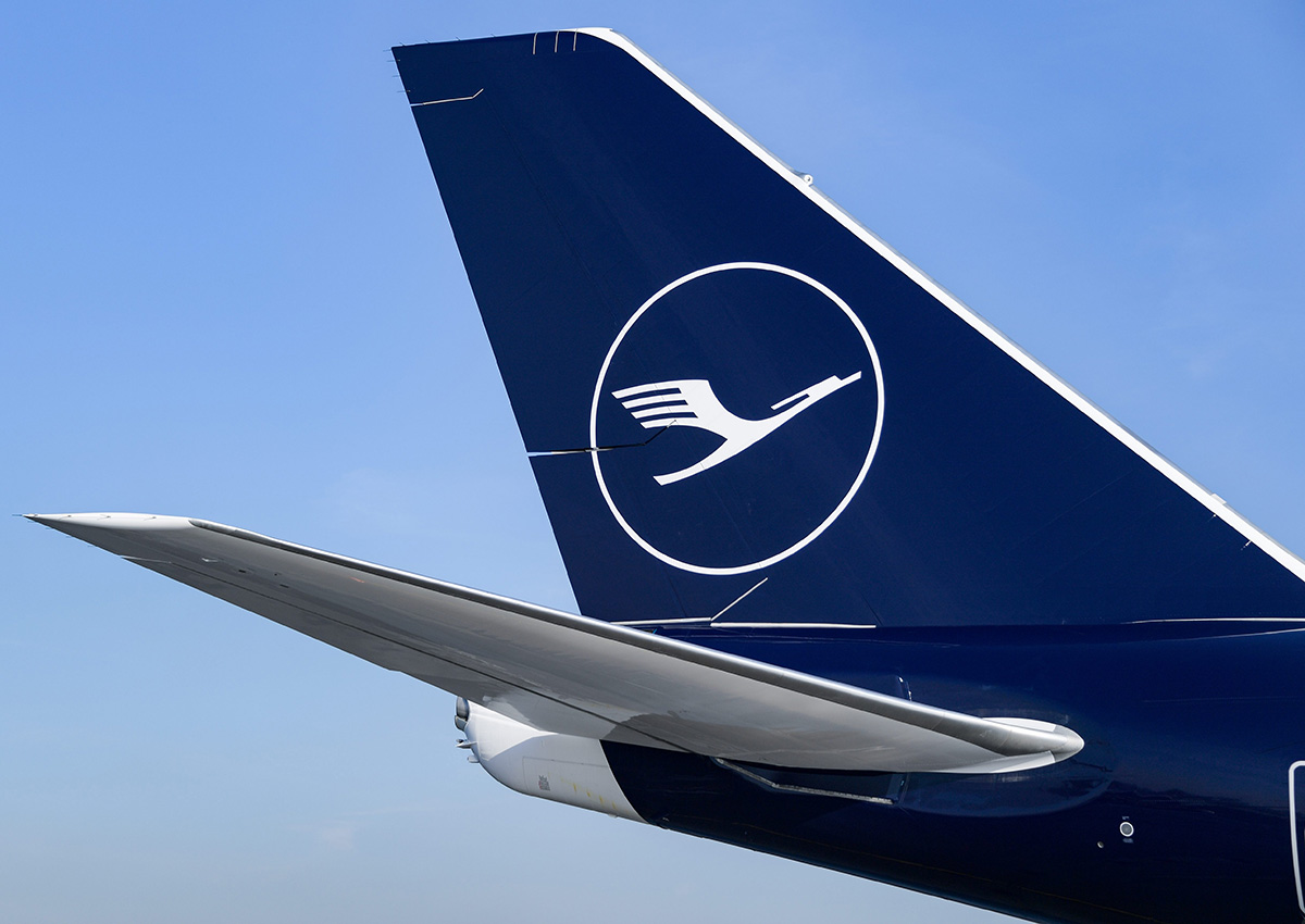 A Lufthansa Boeing 747-8 featuring the company's new crane logo parked in the Helmut Schmidt Airport in Hamburg, Germany.