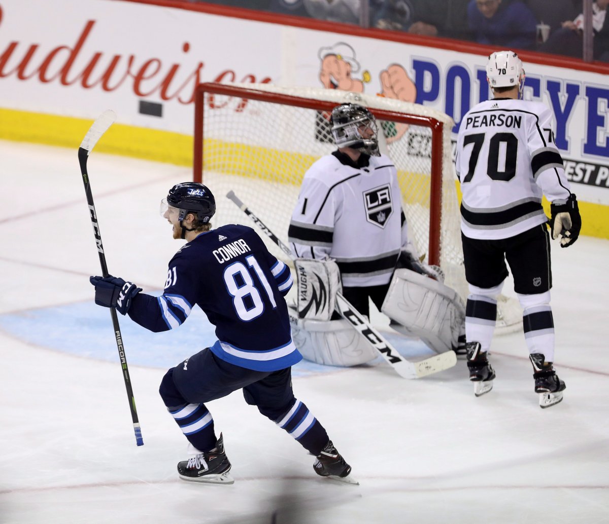 Winnipeg Jets left wing Kyle Connor (81) celebrates after he scored the game winning goal in overtime on Los Angeles Kings goaltender Jack Campbell (1) during NHL hockey action in Winnipeg, Tuesday, March 20, 2018.