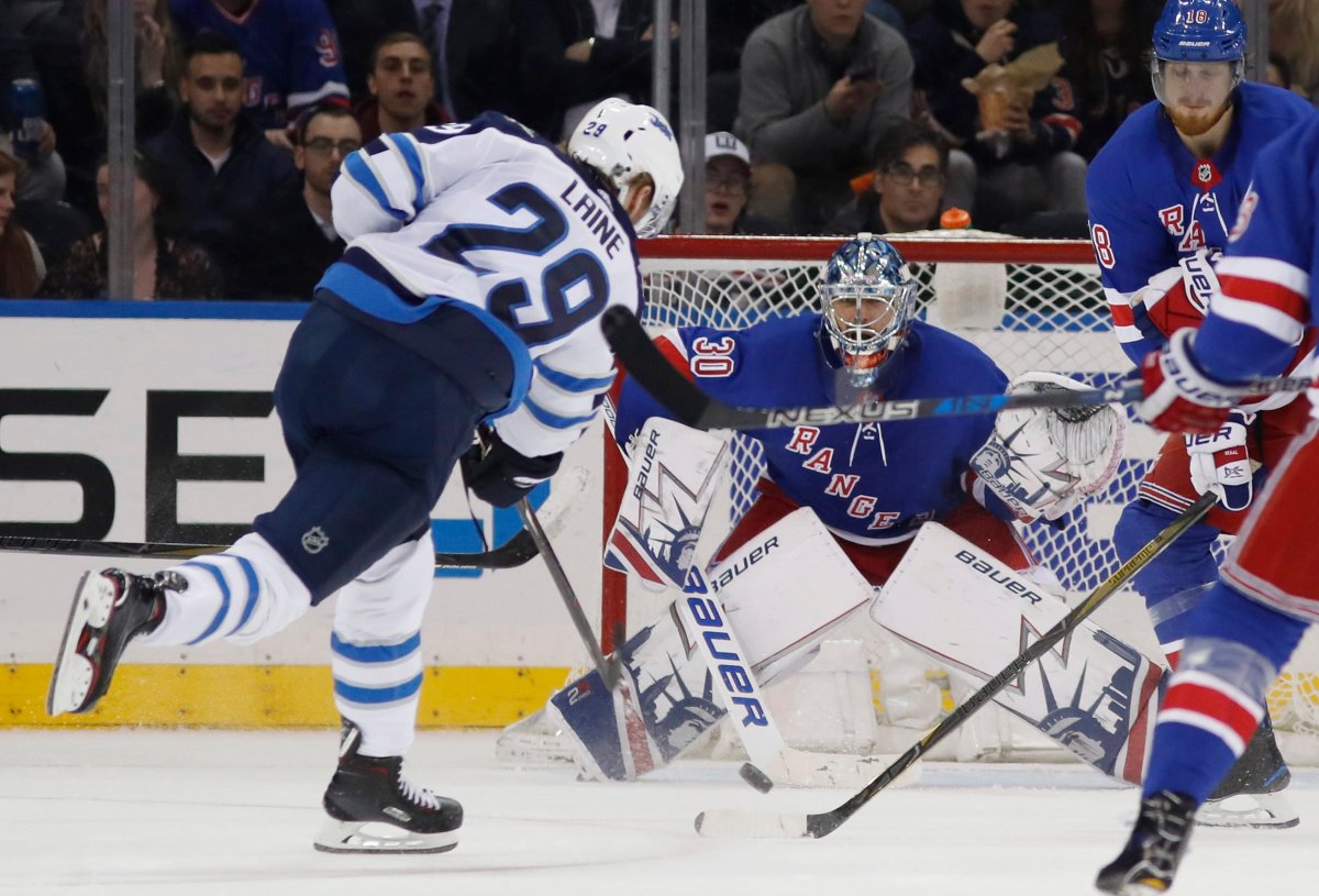 Winnipeg Jets right wing Patrik Laine (29) of Finland shoots against New York Rangers goalie Henrik Lundqvist of Sweden during the second period of an NHL hockey game in New York, Tuesday, March 6, 2018. Laine had a hat trick as the Jets shut out the Rangers 3-0. (AP Photo/Kathy Willens).