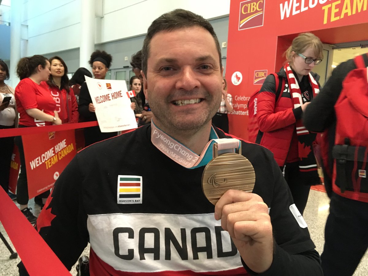 Mark Ideson, the skip for team Canada, displays his bronze medal.