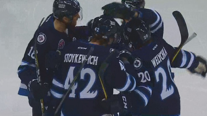 The Manitoba Moose celebrate Peter Stoykewych's first period goal in their loss to the Iowa Wild on Sunday at Bell MTS Place.
