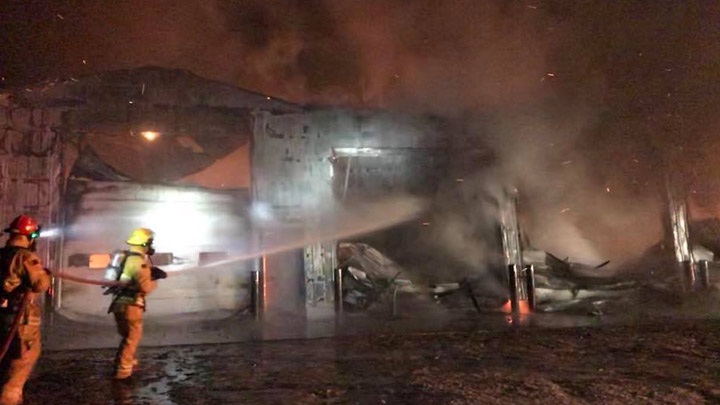 Firefighters battle a farm structure blaze near Osler, Sask.