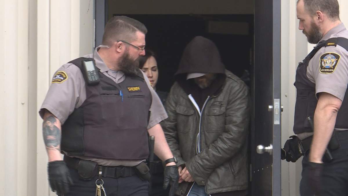 Owen Patrick Nelson is led from court last week in Dartmouth, after being charged with interfering with the remains of Karen MacKenzie. Her body has not been located. 