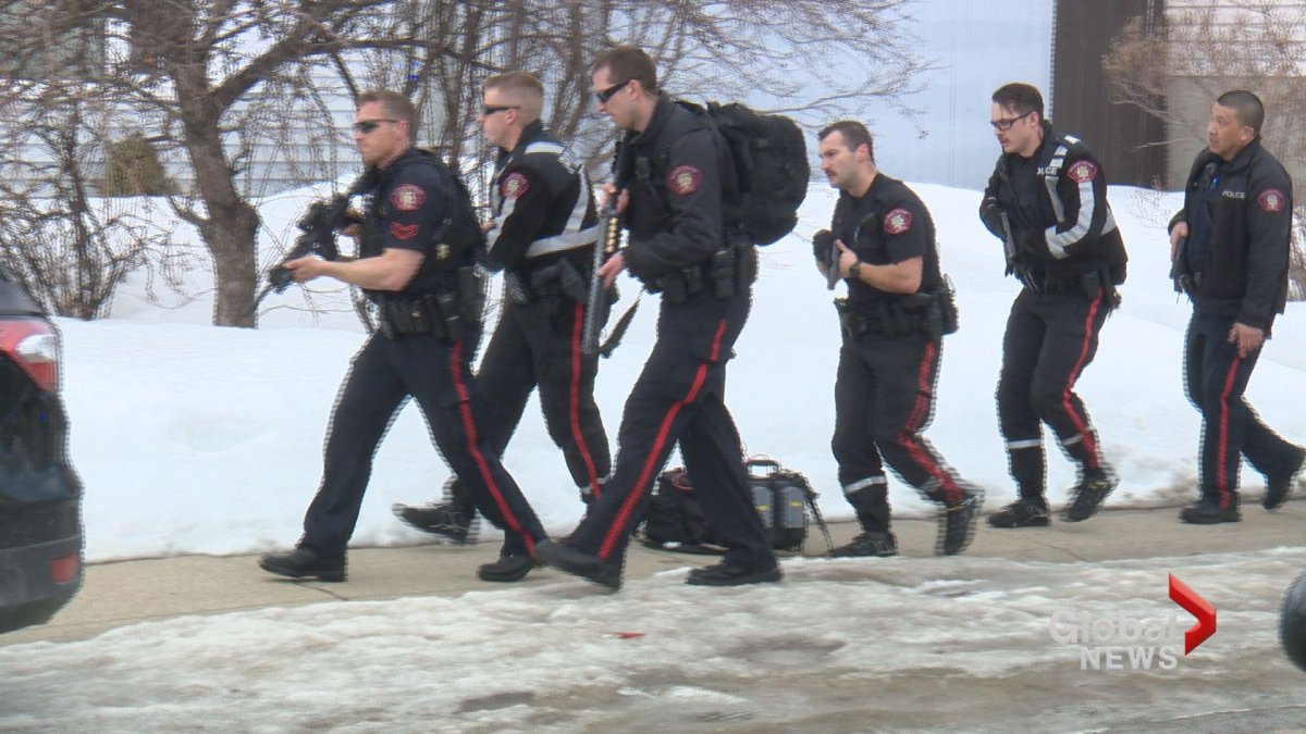 Calgary police officers on the scene of a gun call where an officer was shot on Tuesday, March 27.