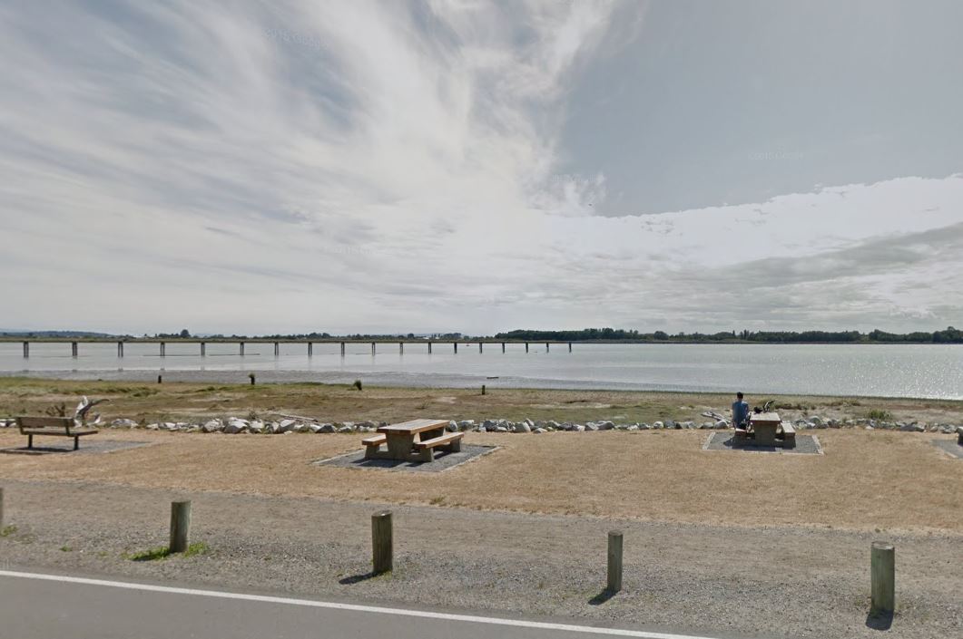 View of the beach off Dyke Road, where the victim was found in the water Saturday morning.