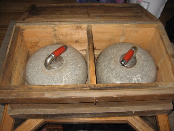 An old matched set of curling rocks that Sheila McNulty collected, a small portion of her “curling museum” filled with other memorabilia.