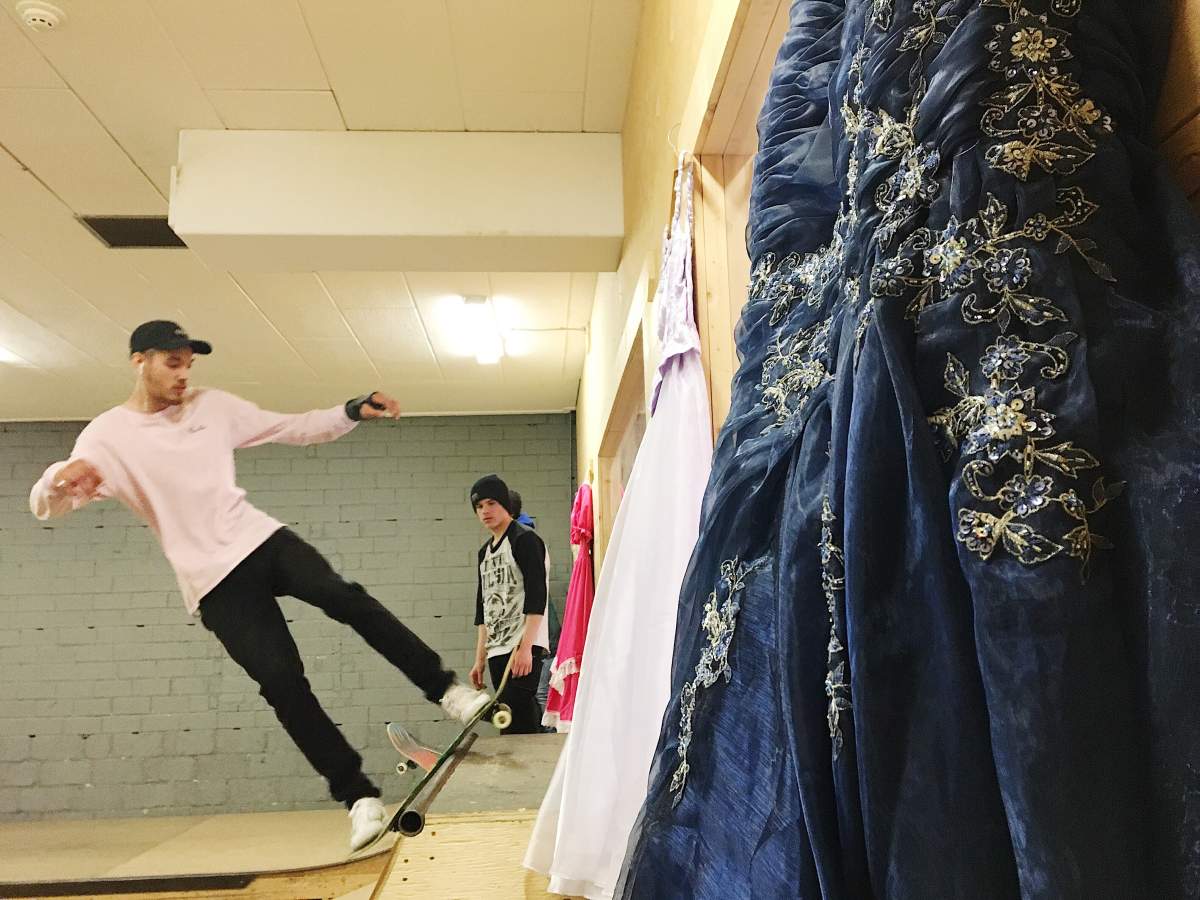Skateboarders with donated dresses