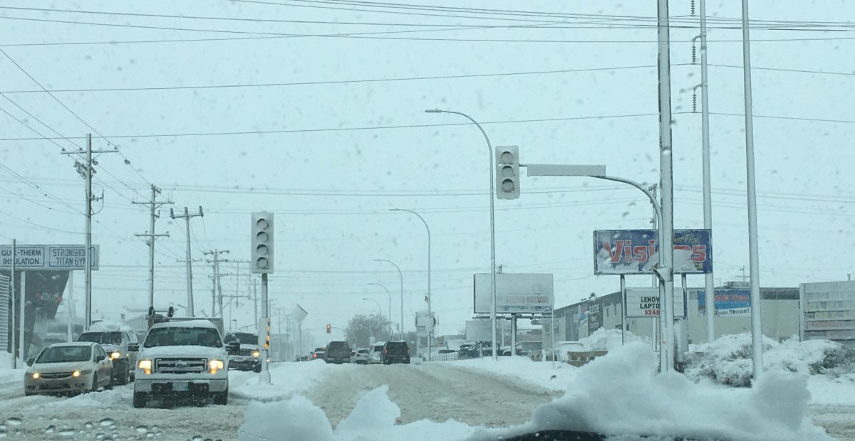 Many traffic lights around Winnipeg were covered in snow Monday morning.