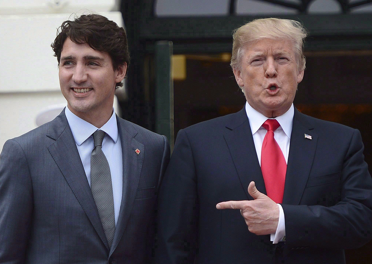 Justin Trudeau is greeted by Donald Trump as he arrives at the White House in Washington, D.C., on October 11, 2017.