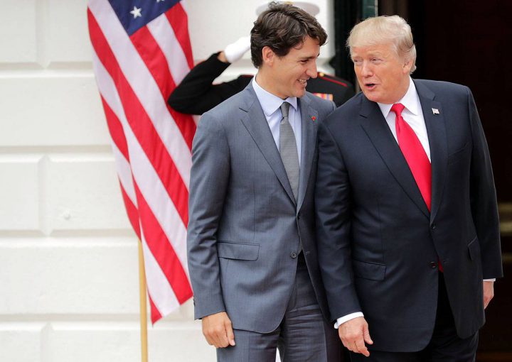 Donald Trump (R) and Canadian Prime Minister Justin Trudeau pose for photographs after Trudeau's arrival at the White House October 11, 2017 in Washington, DC. 