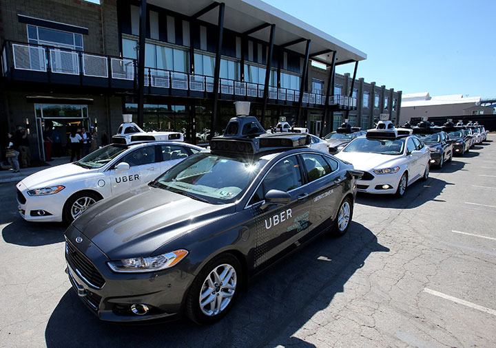 A fleet of Uber's Ford Fusion self-driving cars are shown during a demonstration in Pittsburgh, Pennsylvania, September 13, 2016.  