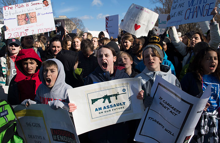 Thousands of local students protest as they rally during a nationwide student walkout for gun control in front the White House in Washington, DC, March 14, 2018.