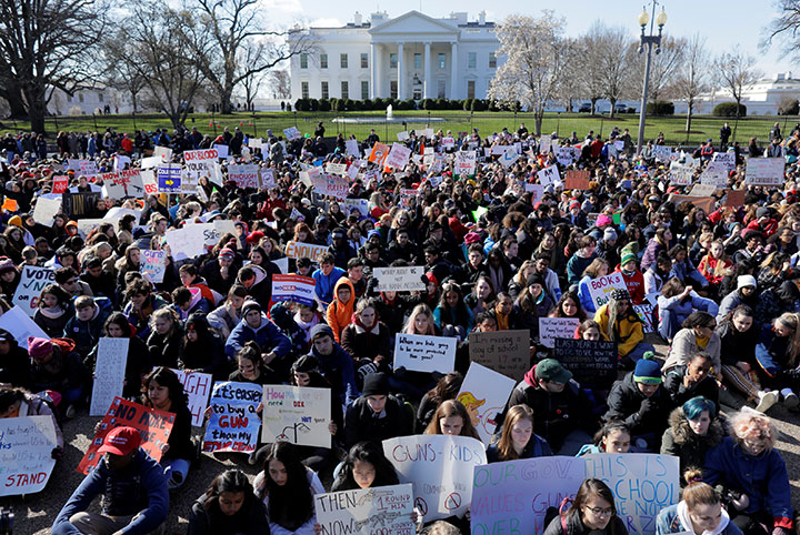 Students gather outside the White House in Washington, U.S., as they join thousands of students across the country walking out of classes to demand stricter gun laws March 14, 2018.