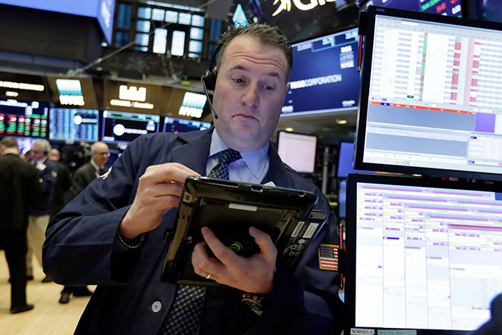 A trader works on the floor of the New York Stock Exchange, Wednesday, March 21, 2018. 