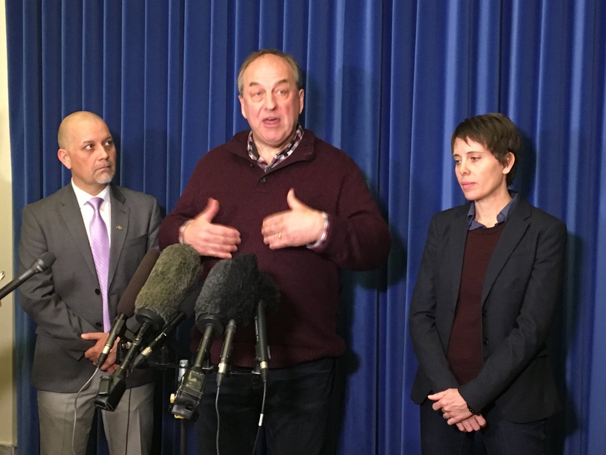 Green Party leader Andrew Weaver, surrounded by Green Party MLAs Adam Olsen and Sonia Furstenau, says he has lost confidence in the NDP.