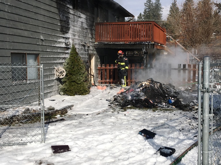 Woman arrested after West Kelowna house fire - image
