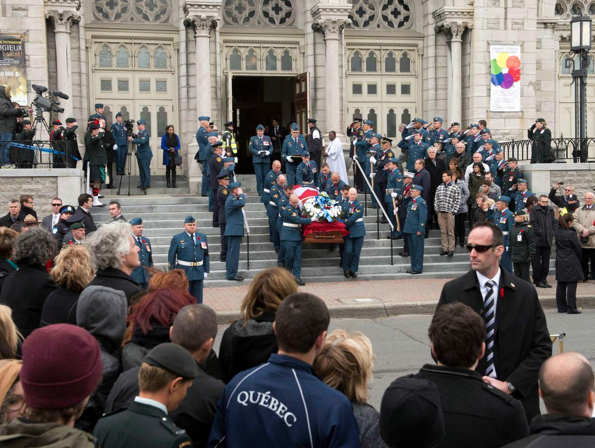 The casket of warrant officer Patrice Vincent leaves the church after funeral services Nov. 1, 2014 in Longueuil, Que. On social media, Othman Ayed Hamdan allegedly called Vincent’s killer a “hero.” THE CANADIAN PRESS/Ryan Remiorz