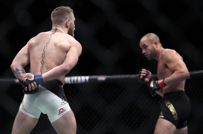 Conor McGregor, left, taunts Eddie Alvarez during their lightweight title mixed martial arts bout at UFC 205, Nov. 13, 2016, at Madison Square Garden in New York.